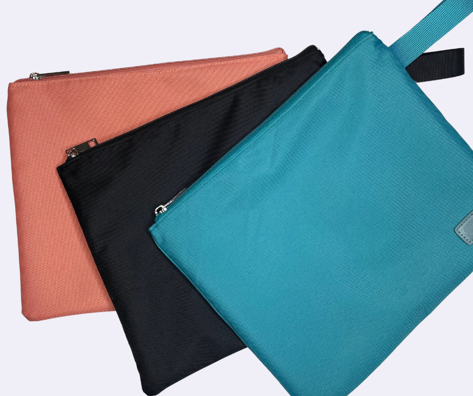 pink, black and blue water resistant bikini bags on a white background