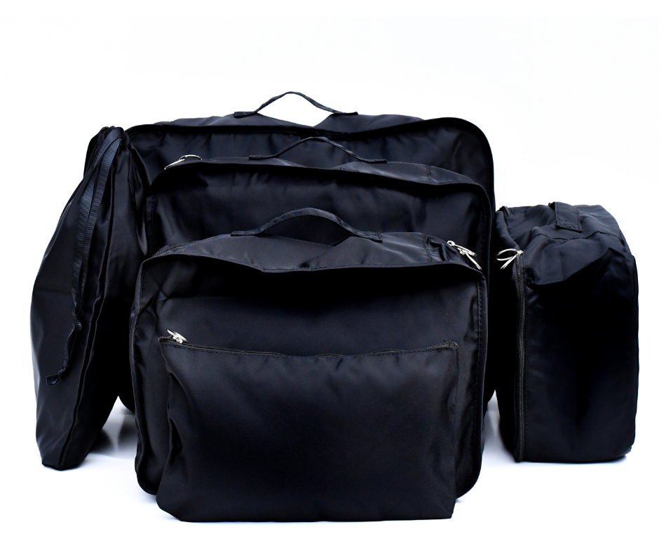 black packing cubes all packed up on a white background