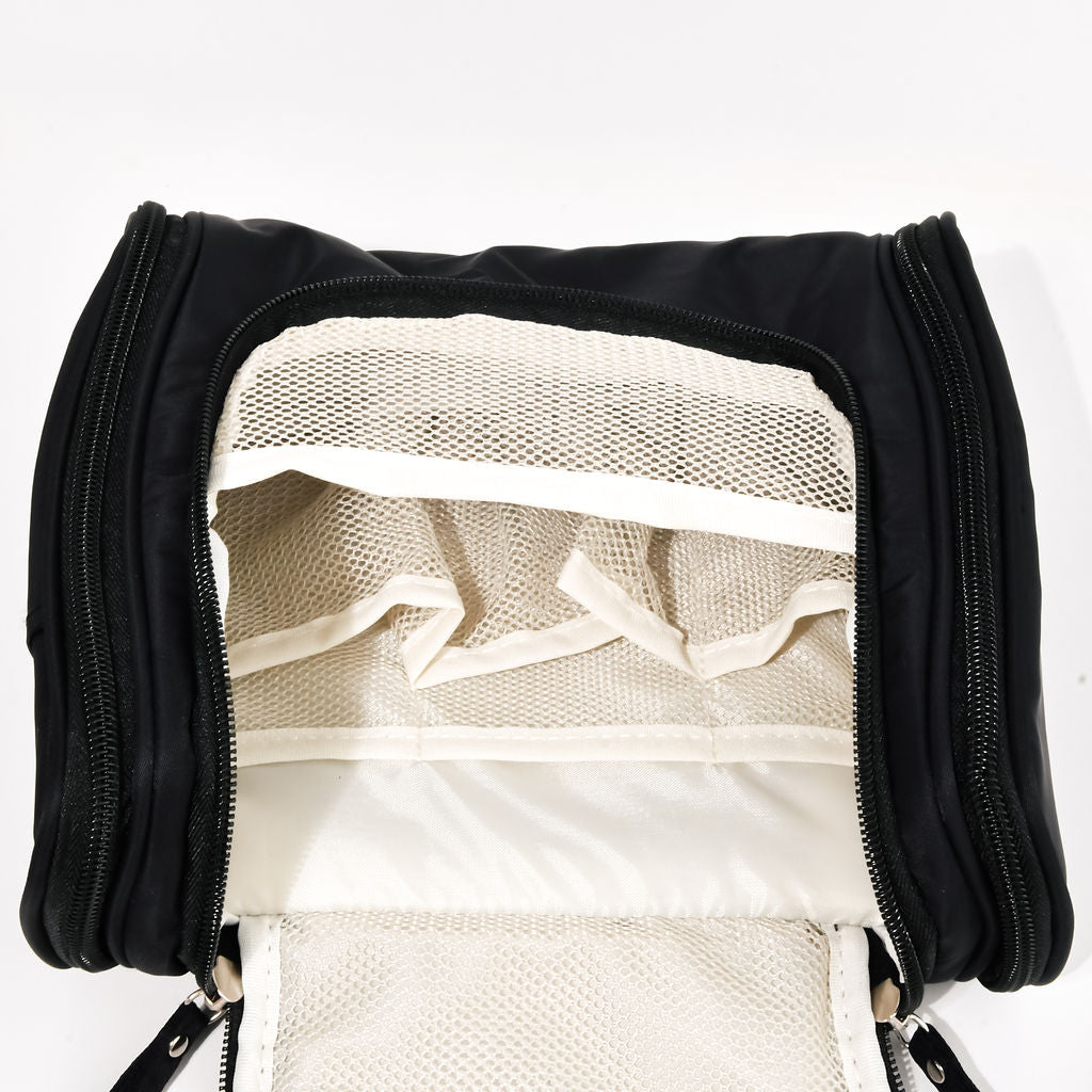black hanging cosmetic case opened up on a white background