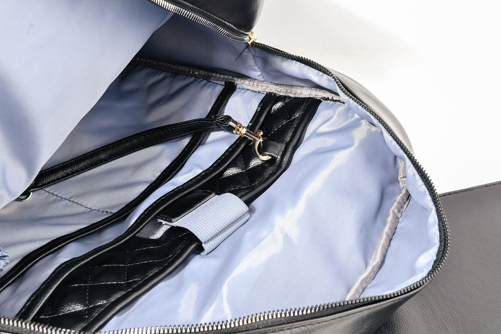 black backpack opened up on a white background