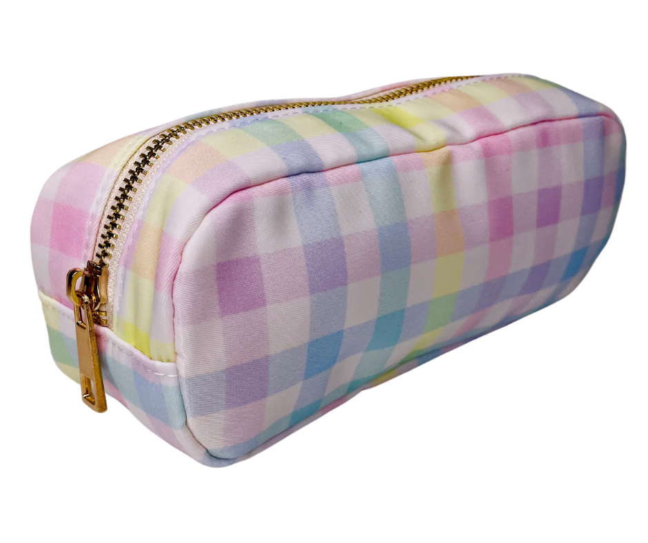 rainbow cosmetic case on a white/light grey background 