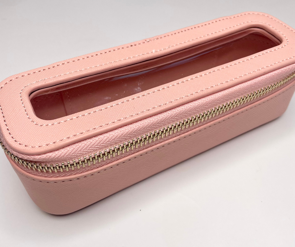 pink mini cosmetic case on a white background