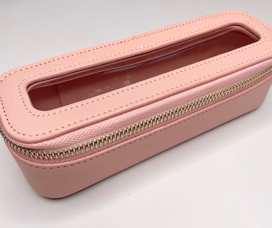pink mini cosmetic case on a white background