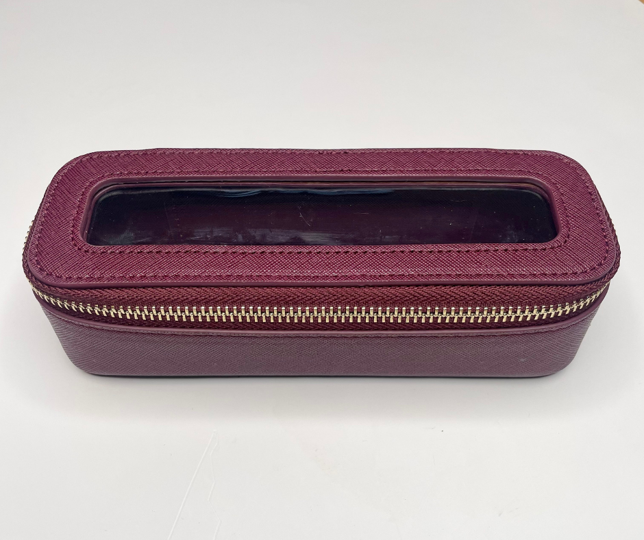 purple mini cosmetic case on a white background