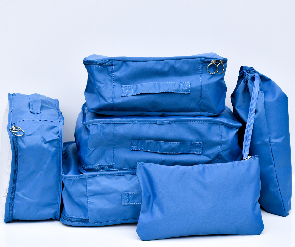 blue packing cubes, packed and on a white background