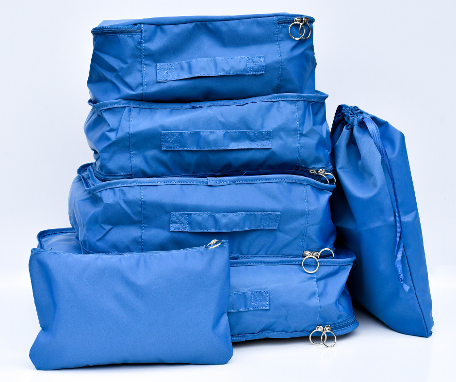 blue packing cubes, packed and on a white background