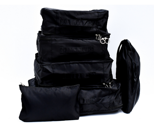 black packing cubes all packed up on a white background