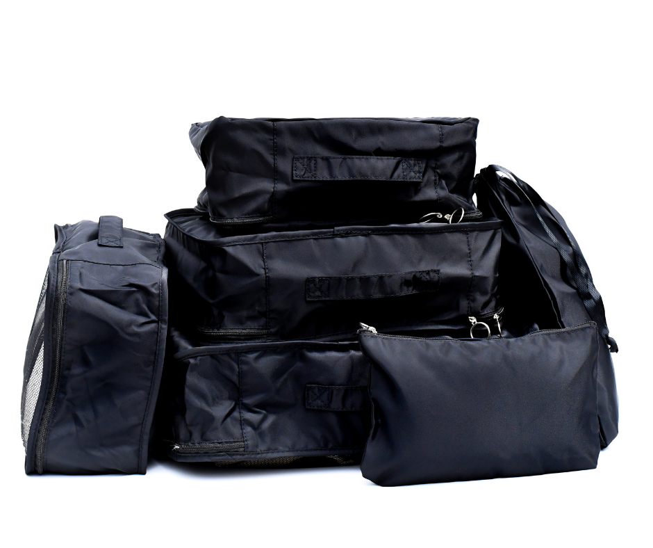 black packing cubes all packed up on a white background