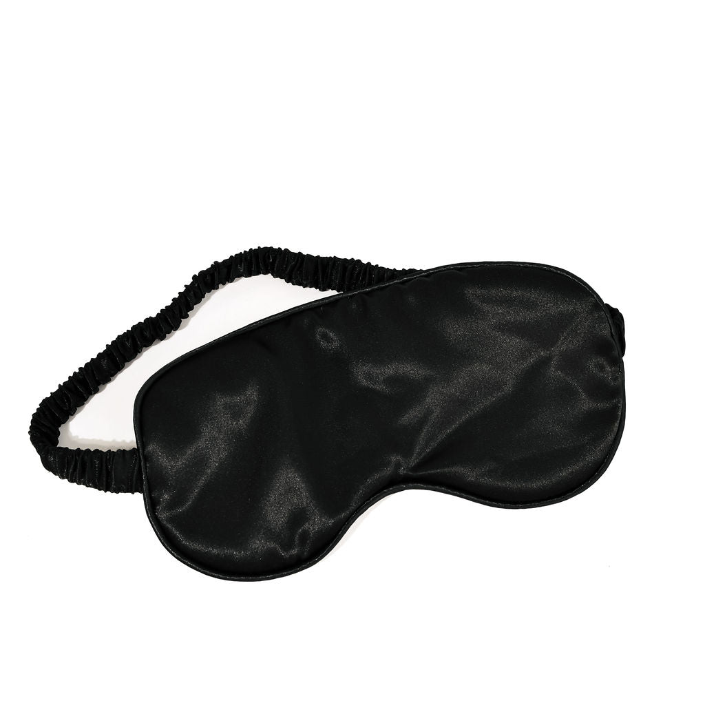 black eye mask/sleep mask on a white background