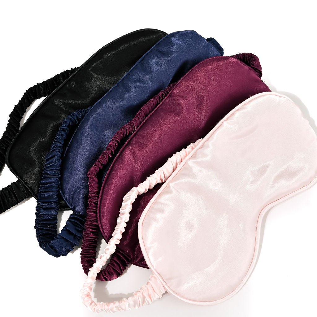 4 x sleep masks/eye masks on a white background