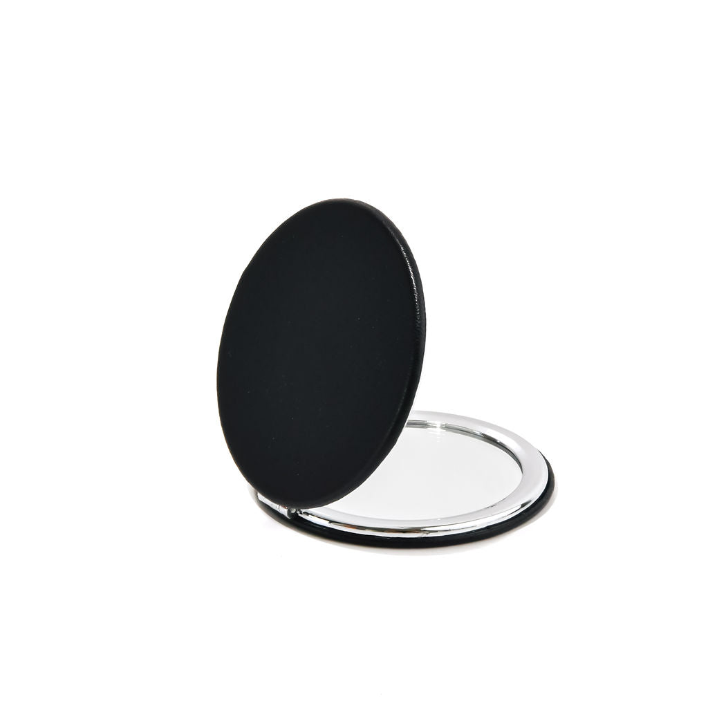 black compact mirror on a white background