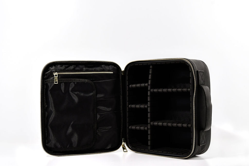 black cosmetic case on its side showing the features of the moveable inserts