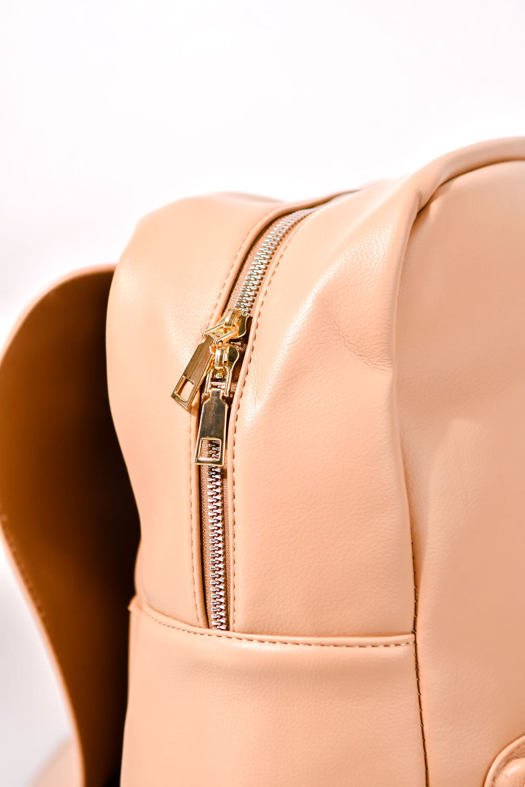 tan backpack zip view on a white background