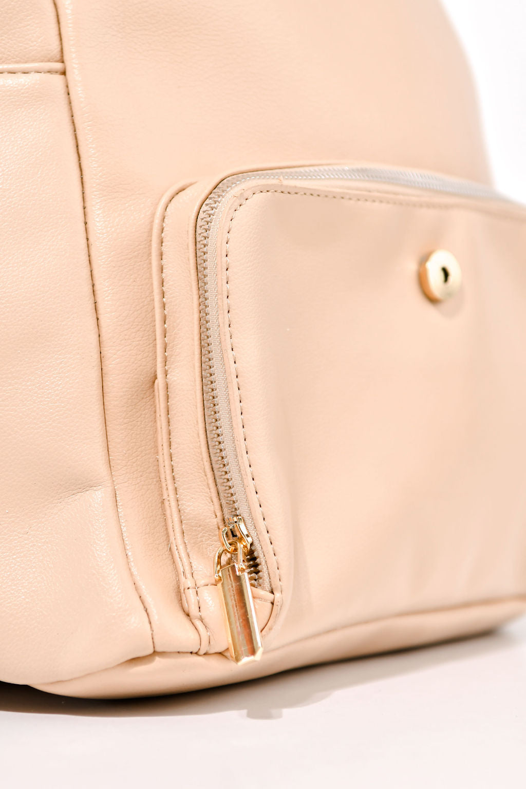 beige backpack front pocket on a white background
